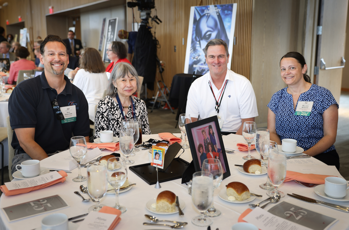Josh Freedman, Ping Lee (50-year achiever), Melissa Sheehan, and [?] enjoy the start of the luncheon.