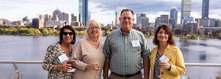 Folks enjoy the Silver Club high Tea out on the Samberg Center deck.