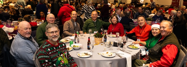 Members gather for a delicious meal at the 2024 Holiday Party.