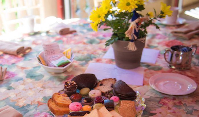 A lovely table set for tea, with pastries.